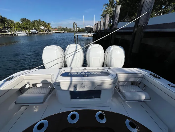  Yacht Photos Pics 2021 Valhalla Boatworks V-41 with four outboard engines docked by the water.
