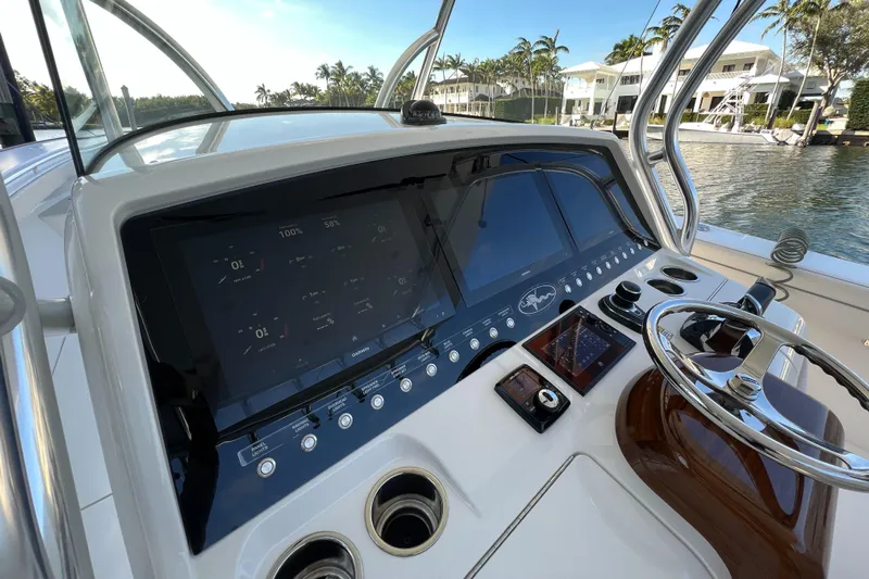  Yacht Photos Pics 2021 Valhalla Boatworks V-41 helm with modern controls and waterfront view.