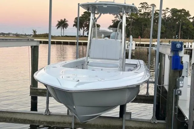  Yacht Photos Pics 2025 Contender 26 Bay boat docked at sunset, featuring sleek design and modern amenities.