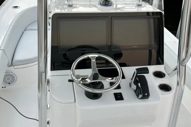  Yacht Photos Pics 2025 Contender 26 Bay boat console with dual screens and steering wheel.