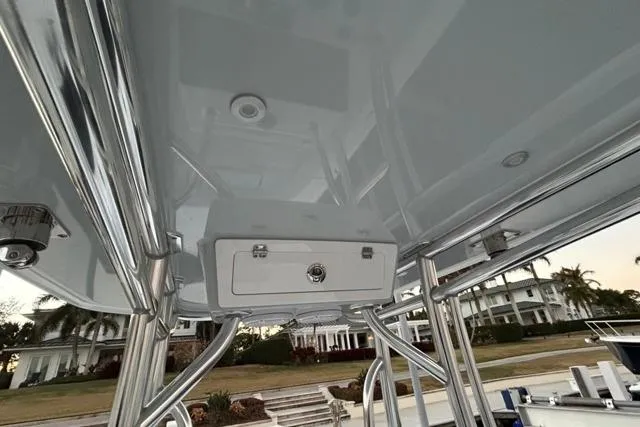  Yacht Photos Pics 2025 Contender 26 Bay boat with sleek T-top and storage compartment.