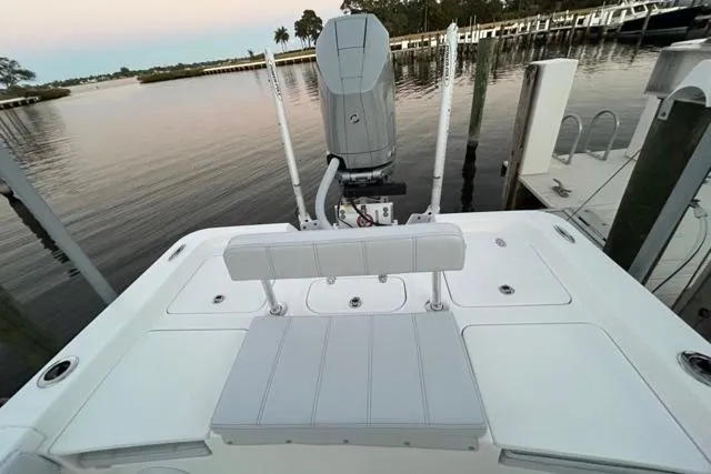  Yacht Photos Pics 2025 Contender 26 Bay boat at dock, featuring sleek design and modern outboard motor.