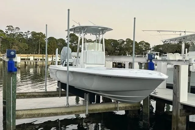  Yacht Photos Pics 2025 Contender 26 Bay boat docked at marina, showcasing sleek design and modern features.