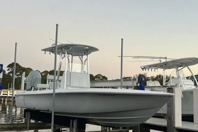  Yacht Photos Pics 2025 Contender 26 Bay boat docked at marina, featuring sleek design and modern amenities.