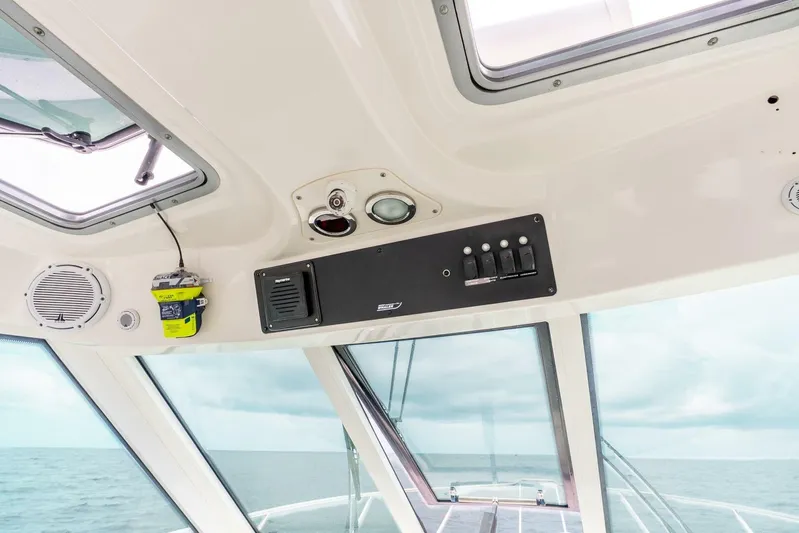 Reel Blessing Yacht Photos Pics Interior view of 2012 Boston Whaler 345 Conquest boat cockpit with control panel.