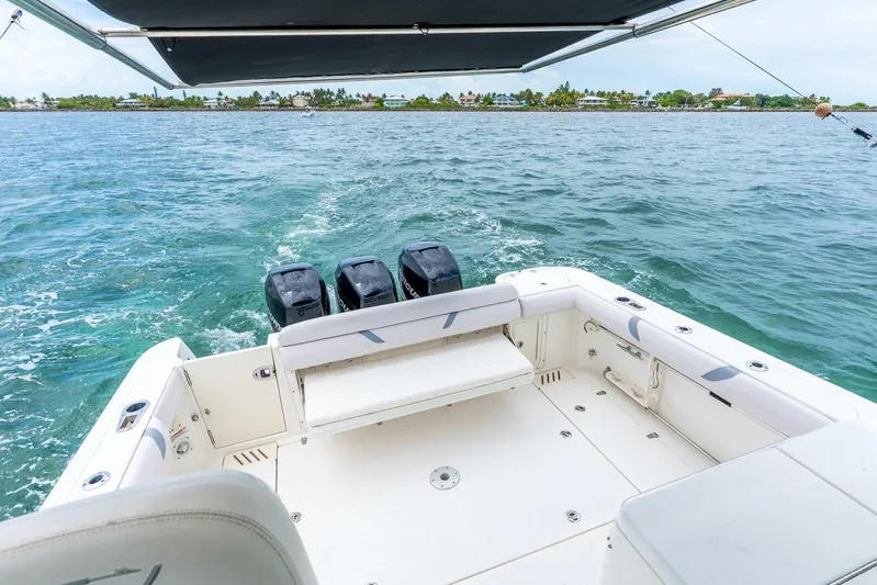 Reel Blessing Yacht Photos Pics 2012 Boston Whaler 345 Conquest boat with triple engines on open water.
