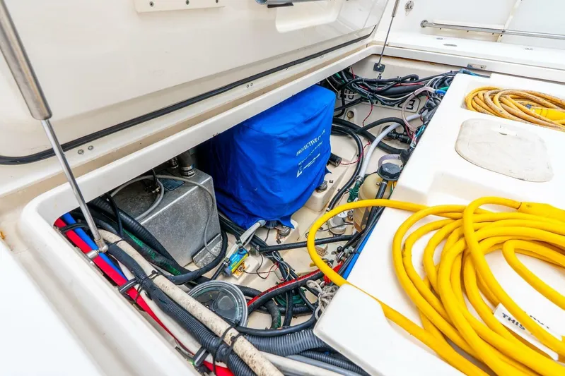 Reel Blessing Yacht Photos Pics 2012 Boston Whaler 345 Conquest engine compartment with cables and equipment.