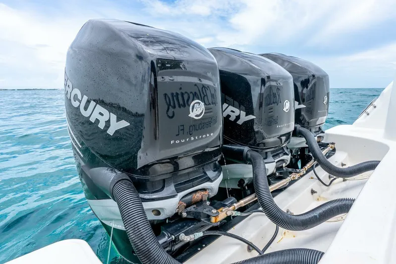 Reel Blessing Yacht Photos Pics Triple Mercury outboard engines on a 2012 Boston Whaler 345 Conquest in open water.