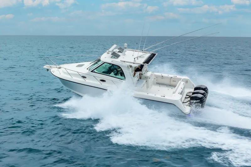 Reel Blessing Yacht Photos Pics 2012 Boston Whaler 345 Conquest cruising on open ocean waters.