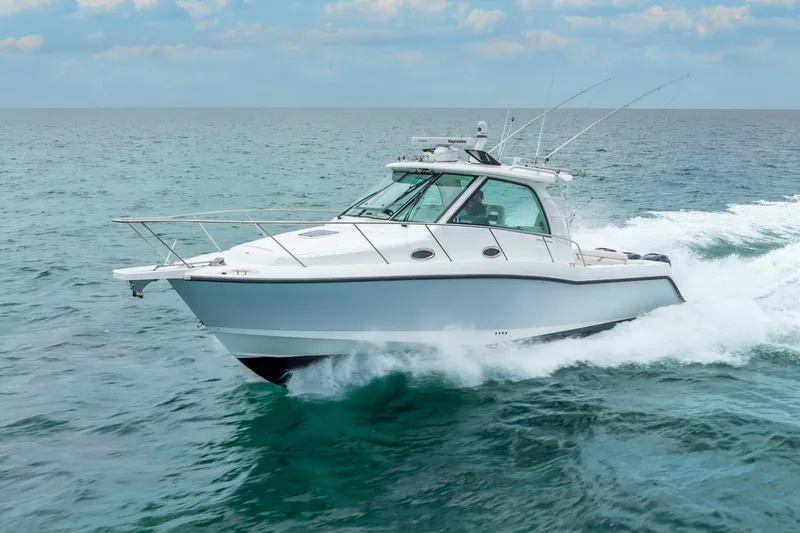 Reel Blessing Yacht Photos Pics 2012 Boston Whaler 345 Conquest cruising on open ocean waters.