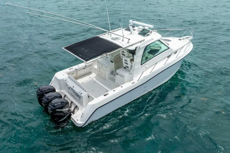 Reel Blessing Yacht Photos Pics 2012 Boston Whaler 345 Conquest boat on water with triple Mercury engines.