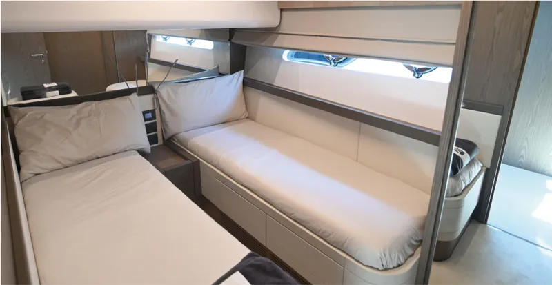  Yacht Photos Pics Luxurious cabin interior of 2022 Ferretti Yachts 550 with twin beds and modern design.