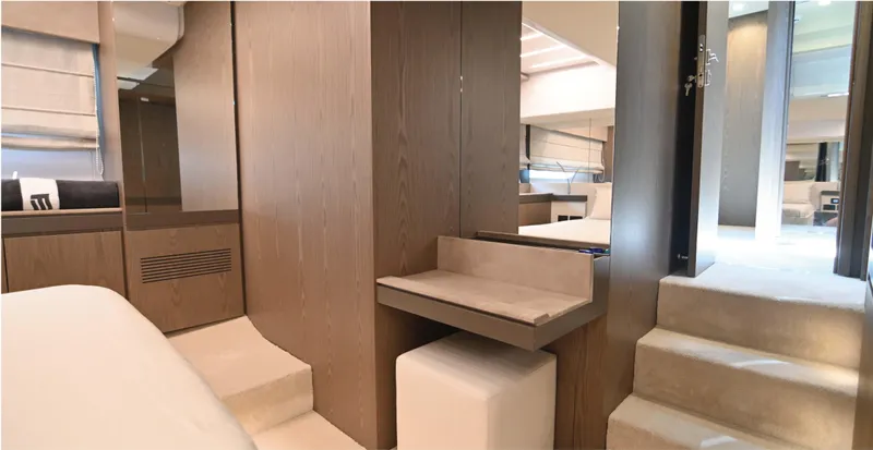  Yacht Photos Pics Luxurious interior of 2022 Ferretti Yachts 550, featuring elegant wood finishes and modern design.