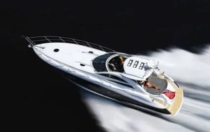  Yacht Photos Pics 2007 Sunseeker Portofino 53 yacht cruising at high speed on open water.