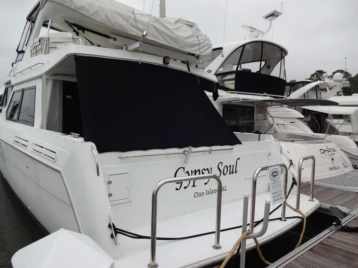 Gypsy Soul Yacht Photos Pics 1998 Navigator 53 Classic yacht docked, named "Gypsy Soul," with covered windows.