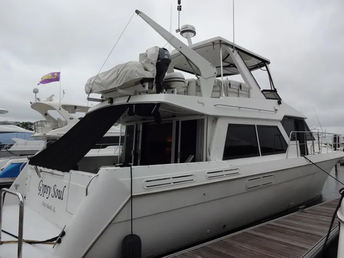 Gypsy Soul Yacht Photos Pics 1998 Navigator 53 Classic yacht docked, featuring sleek design and spacious upper deck.