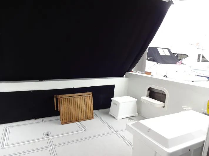 Gypsy Soul Yacht Photos Pics 1998 Navigator 53 Classic yacht interior with wooden table and seating area.