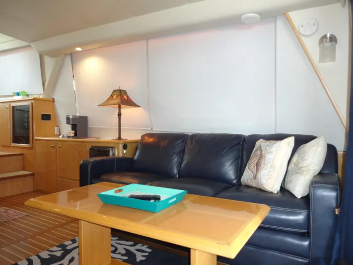 Gypsy Soul Yacht Photos Pics Luxurious 1998 Navigator 53 Classic yacht interior with leather sofa and elegant decor.