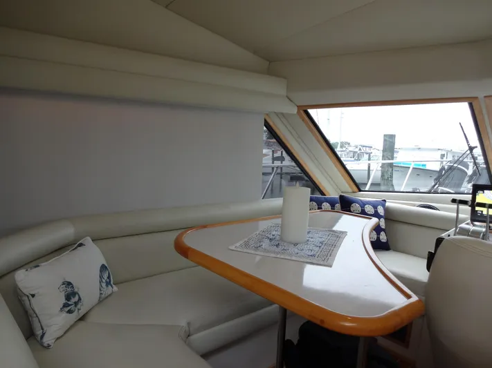 Gypsy Soul Yacht Photos Pics Interior of 1998 Navigator 53 Classic yacht with cozy seating and table.