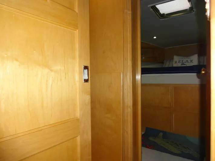 Gypsy Soul Yacht Photos Pics Interior of 1998 Navigator 53 Classic yacht with wooden door and cozy cabin.