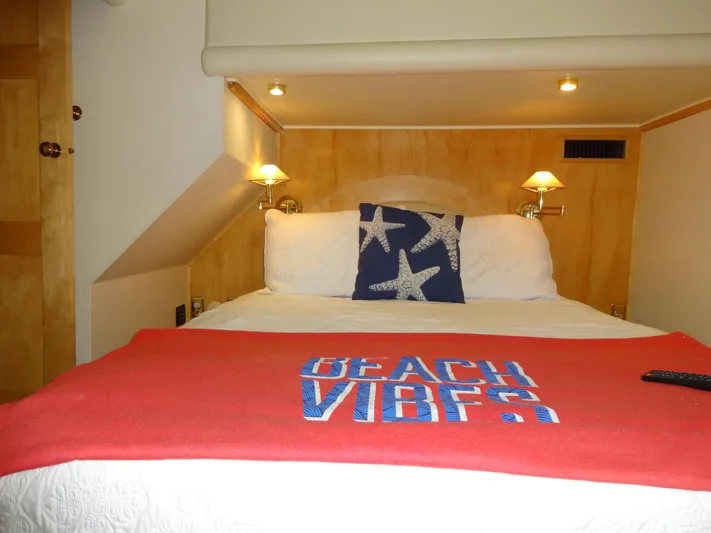 Gypsy Soul Yacht Photos Pics Cozy bedroom in 1998 Navigator 53 Classic yacht with beach-themed decor.