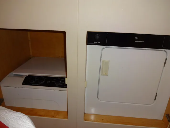 Gypsy Soul Yacht Photos Pics Laundry area with washer and dryer in 1998 Navigator 53 Classic yacht.