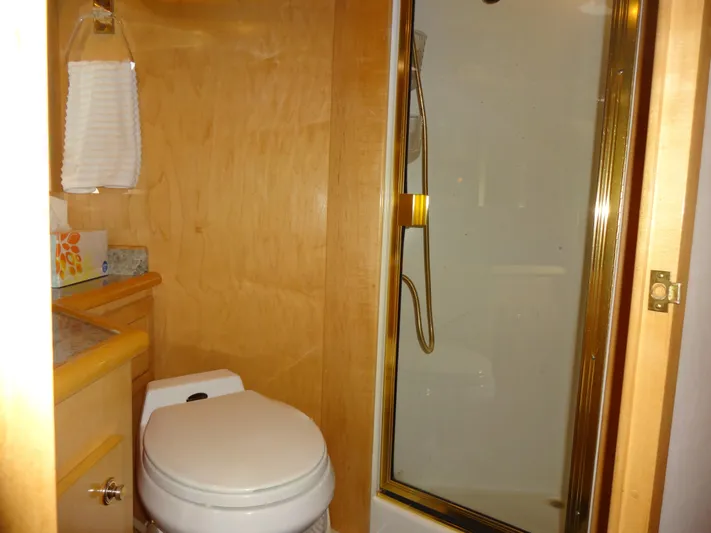 Gypsy Soul Yacht Photos Pics Bathroom interior of 1998 Navigator 53 Classic yacht with shower and toilet.
