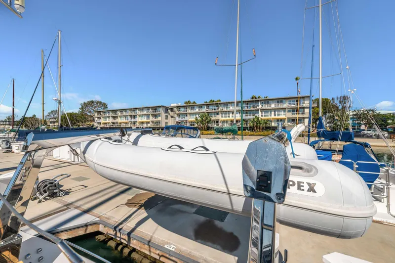 Perfect Symmetry Yacht Photos Pics Hylas 70 yacht with Apex inflatable boat docked at marina, 2006 model.