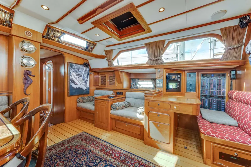 Perfect Symmetry Yacht Photos Pics Luxurious 2006 Hylas 70 yacht interior with elegant wood finish and comfortable seating.