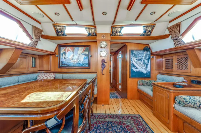 Perfect Symmetry Yacht Photos Pics Luxurious interior of 2006 Hylas 70 yacht with elegant wood finish and nautical decor.