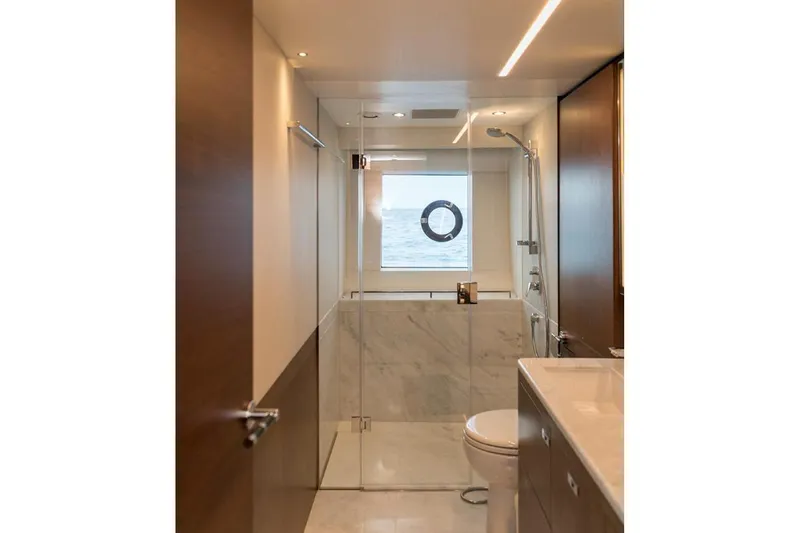  Yacht Photos Pics Modern bathroom on 2020 Princess Y75 yacht with ocean view through window.