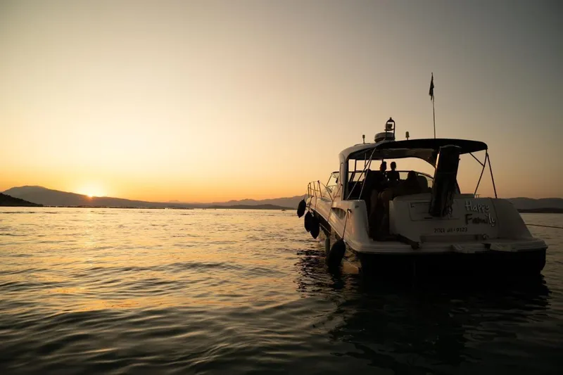  Yacht Photos Pics 2005 Sea Ray 425 Sundancer yacht at sunset on calm waters.