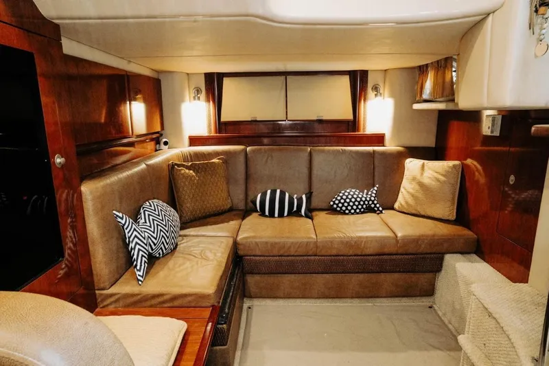  Yacht Photos Pics Luxurious interior of 2005 Sea Ray 425 Sundancer yacht with plush seating and decorative pillows.