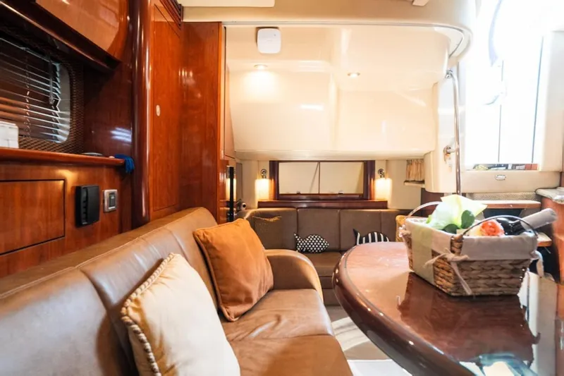  Yacht Photos Pics Luxurious interior of 2005 Sea Ray 425 Sundancer yacht with elegant seating and dining area.