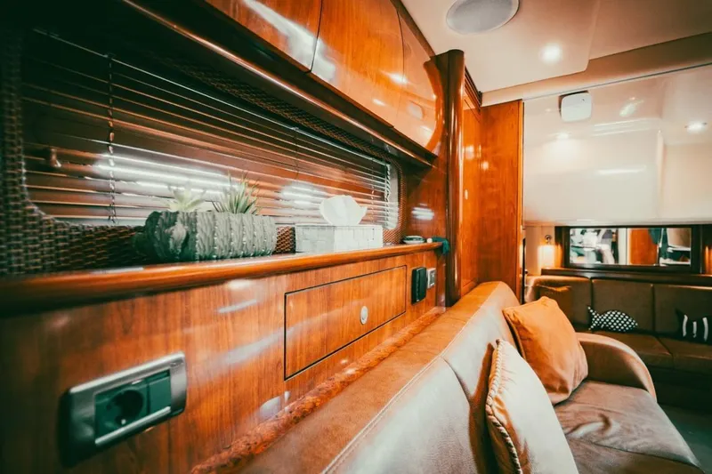  Yacht Photos Pics Luxurious interior of 2005 Sea Ray 425 Sundancer yacht with wooden finishes and cozy seating.