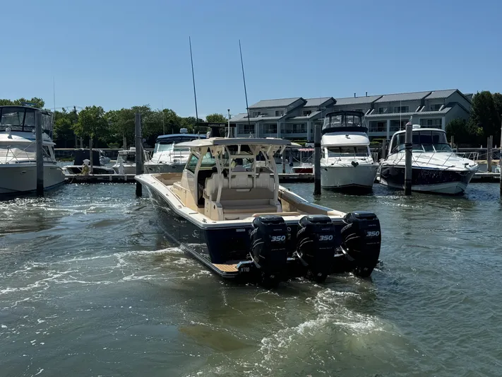  Yacht Photos Pics 2018 Scout 380 LXF boat with triple 350 engines docked at marina.