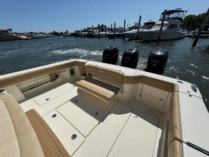  Yacht Photos Pics 2018 Scout 380 LXF boat with triple outboard motors docked at marina.