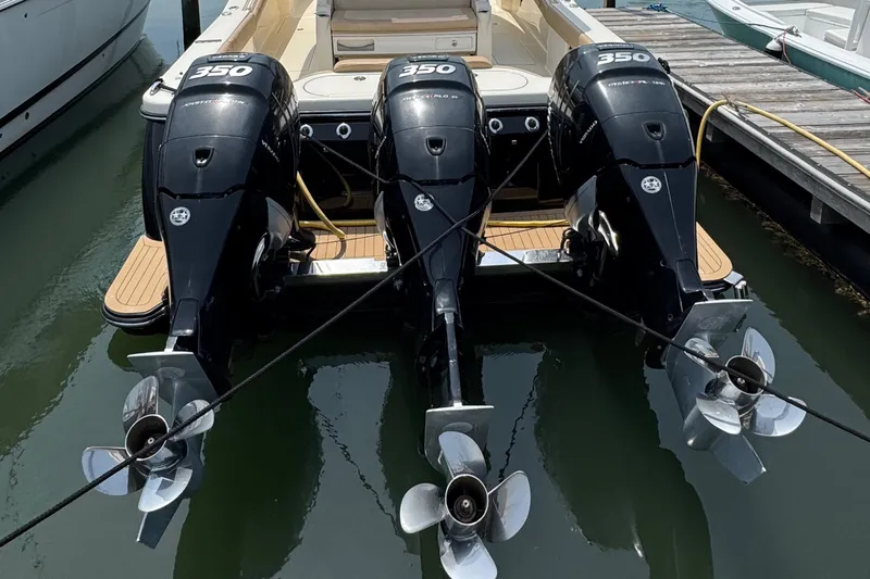  Yacht Photos Pics 2018 Scout 380 LXF boat with triple 350 horsepower outboard engines docked at marina.