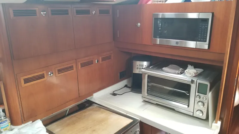  Yacht Photos Pics Galley kitchen in 2003 CNB 64 yacht with microwave and toaster oven.