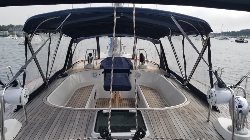 Yacht Photos Pics Deck view of 2003 CNB 64 yacht with covered cockpit and wooden flooring.