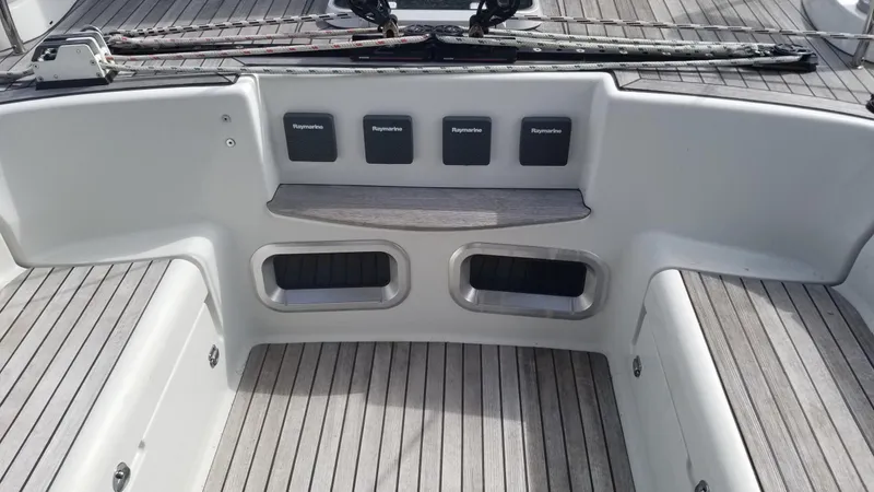  Yacht Photos Pics Cockpit of 2003 CNB 64 yacht with Raymarine instruments and teak flooring.
