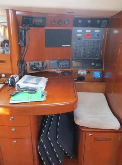  Yacht Photos Pics Navigation station on a 2003 CNB 64 yacht with control panels and equipment.