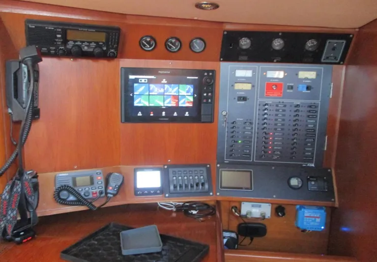  Yacht Photos Pics Control panel of a 2003 CNB 64 yacht with navigation and communication equipment.