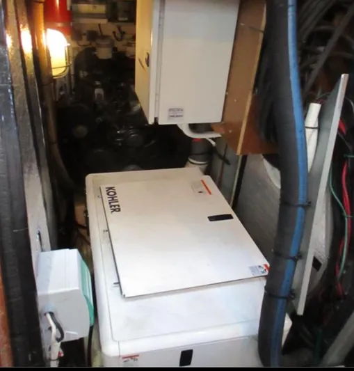  Yacht Photos Pics Engine room of 2003 CNB 64 yacht with Kohler generator and electrical equipment.