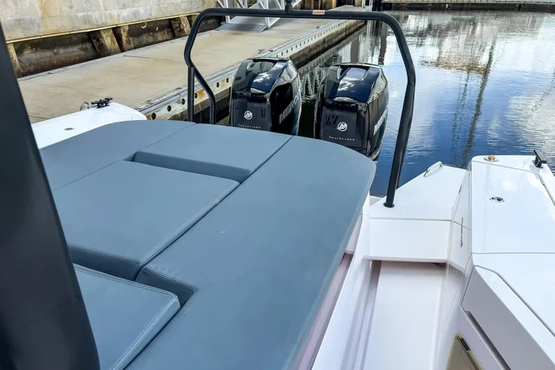  Yacht Photos Pics 2022 Axopar 37 Sun-Top boat with dual Mercury engines docked by the water.