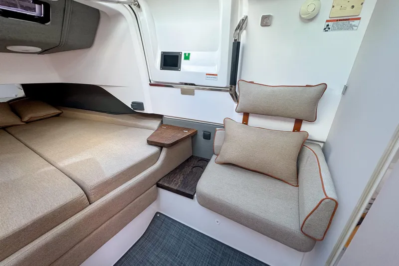  Yacht Photos Pics Luxurious interior of 2022 Axopar 37 Sun-Top with cozy seating and bed.