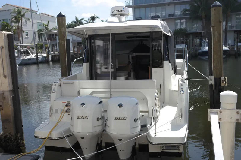  Yacht Photos Pics 2020 Jeanneau NC1095 boat docked with twin 300 engines, rear view.