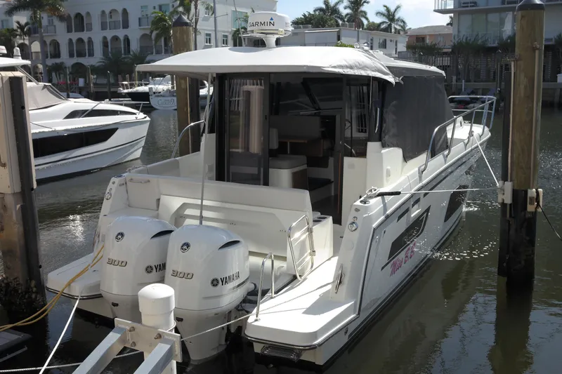  Yacht Photos Pics 2020 Jeanneau NC1095 boat docked with twin Yamaha 300 engines, in a marina setting.