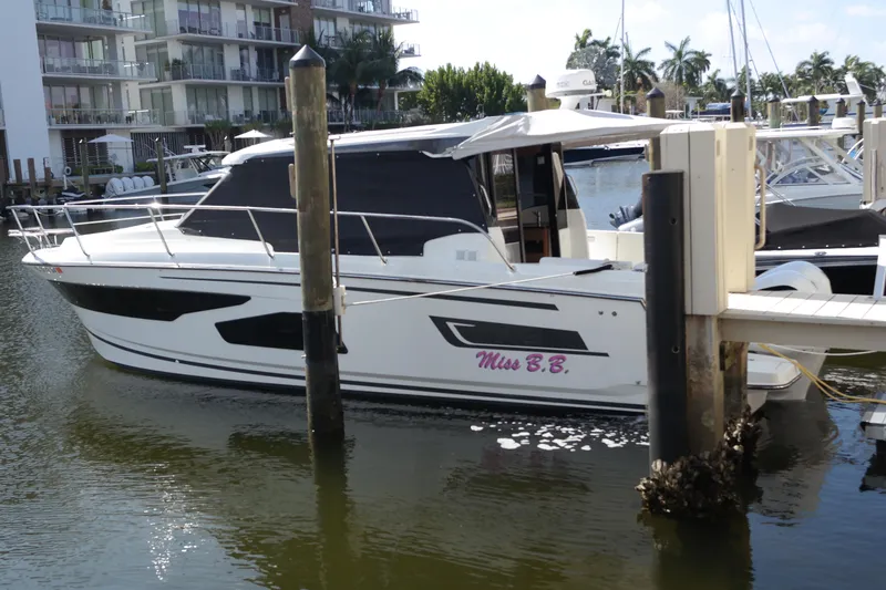  Yacht Photos Pics 2020 Jeanneau NC1095 boat docked at marina, side view.