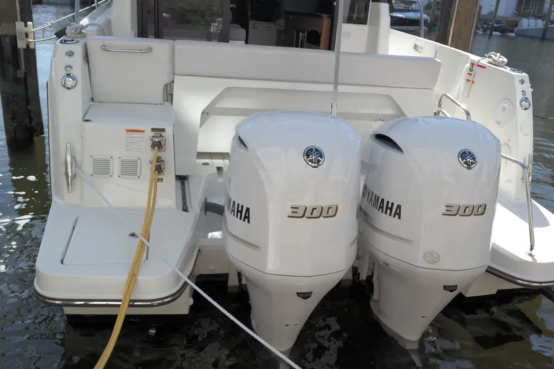  Yacht Photos Pics 2020 Jeanneau NC1095 boat with dual Yamaha 300 engines docked at marina.